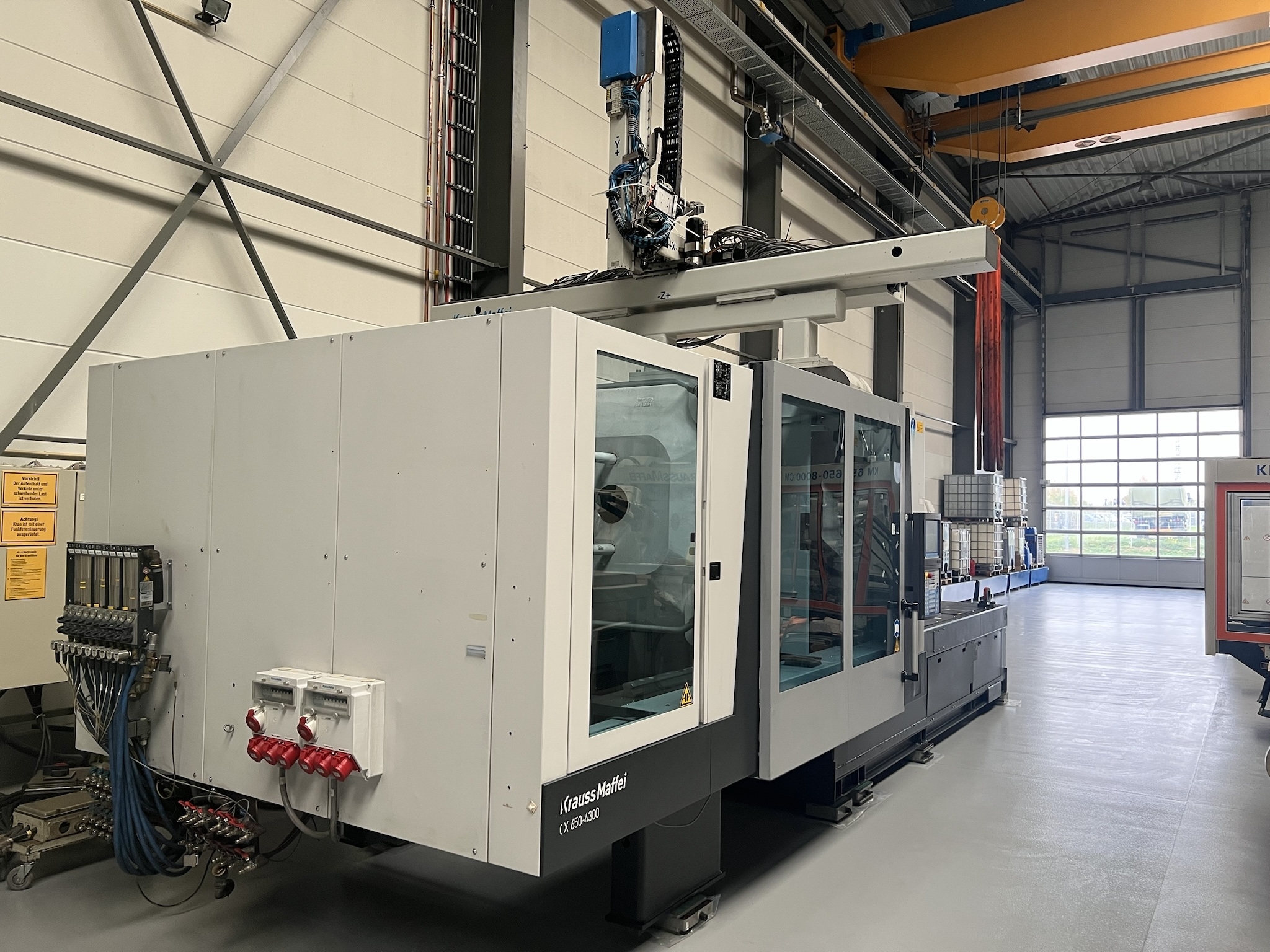 Krauss Maffei KM 650 - 4300CX incl. Krauss Maffei Robot LRX250